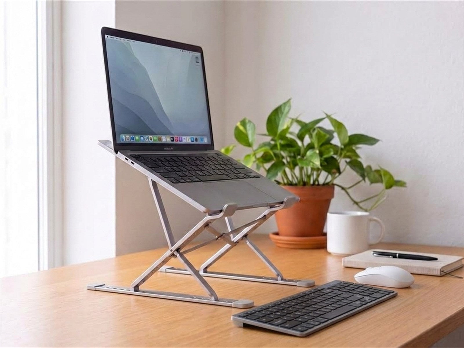 Wireless keyboard — In use · in front of the laptop on its stand
